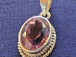 Purple oval stone with a parameter